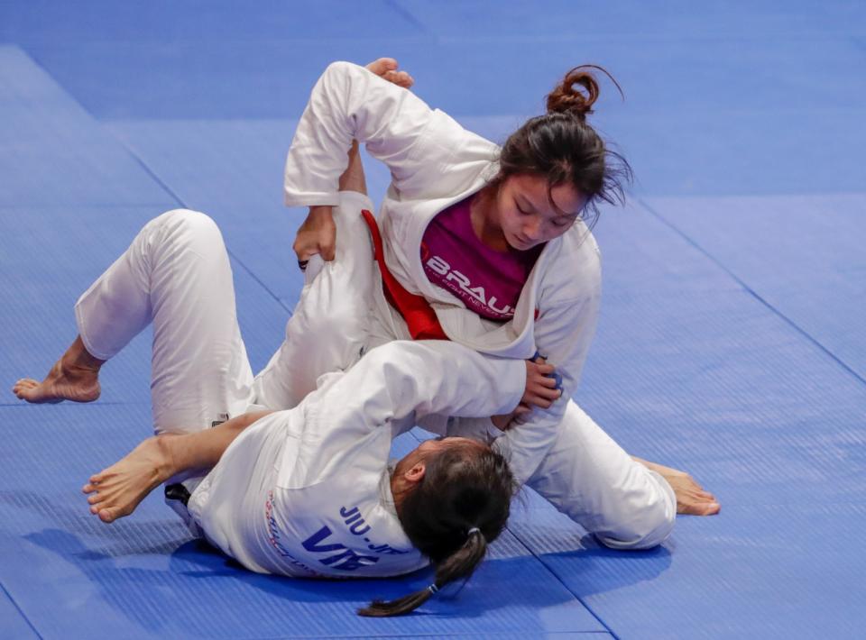 Singapore jiu-jitsu athlete Constance Lien battles Vietnam's Nguyan Ngoc Tu in the women's U-62kg final. (PHOTO: Sport Singapore)