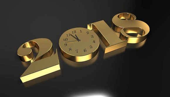 The year 2018 made with large, gold number with the zero made into a round-face clock.