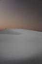 This photo shows the White Sands National Park in New Mexico. "Transformative travel's a trend we're tracking for growth," says Alex Hawkins, editor at the foresight consultancy The Future Laboratory. "It taps into consumers' desire for self-reflective tourism experiences.". (Black Tomato via AP).