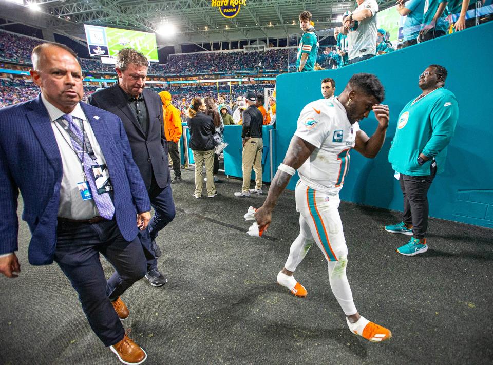 Dolphins receiver Tyreek Hill walks off after the loss to Buffalo last weekend in a game to decide the AFC East champion.