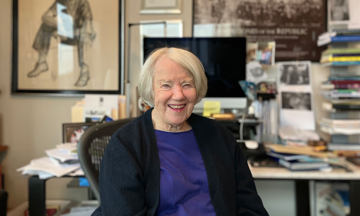 This is a photo of Joy Hakim at her desk in Bethesda, Md.