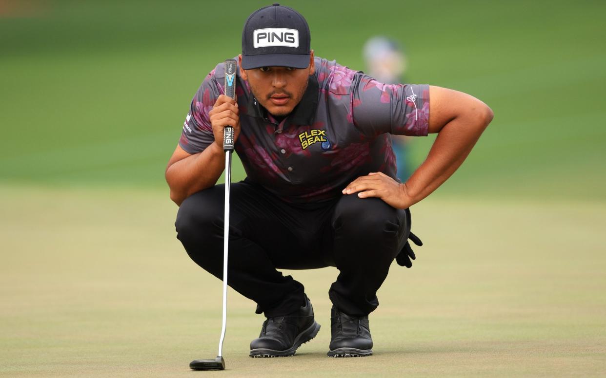 Sebastian Munoz of Colombia lines up a putt on the second green during the third round of the Masters at Augusta National Golf Club - Mike Ehrmann/Getty Images