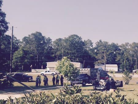 A Tesla Model S involved in the fatal crash on May 7, 2016 is shown with the top third of the car sheared off by the impact of the collision of the Tesla with a tractor-trailer truck on nearby highway and came to rest in the yard of Robert and Chrissy VanKavelaar in Williston, Florida, U.S. on May 7, 2016. Courtesy Robert VanKavelaar/Handout via REUTERS