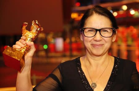 Director Ildiko Enyedi receives the Golden Bear for Best Film 'On Body and Soul' during the awards ceremony at the 67th Berlinale International Film Festival in Berlin, Germany, February 18, 2017. REUTERS/Axel Schmidt