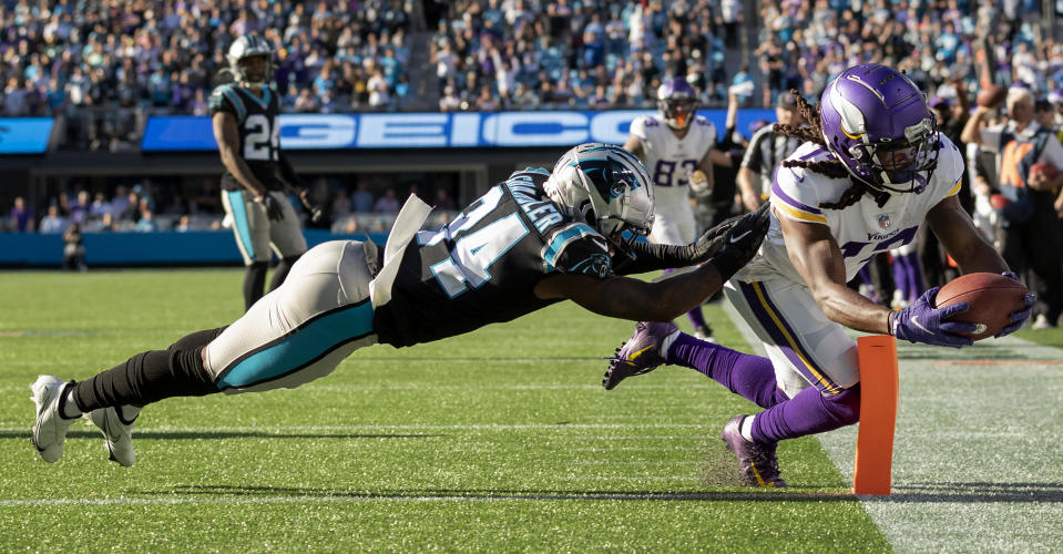 Minnesota Vikings receiver K.J. Osborn (17) catches a 27-yard touchdown reception as Carolina Panthers safety Sean Chandler (34) defends in overtime of an NFL football game, Sunday, Oct. 17, 2021, in Charlotte, N.C. (Carlos Gonzalez/Star Tribune via AP)