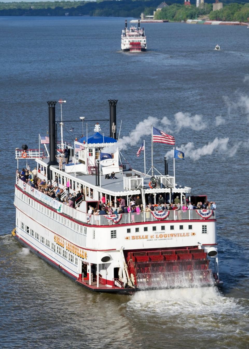 The Belle of Louisville heads chases the Belle of Cincinnati upriver at the start of the Kentucky Derby Festival Great Steamboat Race on Wednesday, May 3, 2023