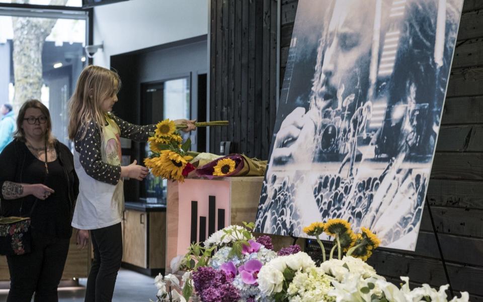 Flowers are placed at a Seattle memorial of Soundgarden vocalist and guitarist Chris Cornell - Credit: Getty