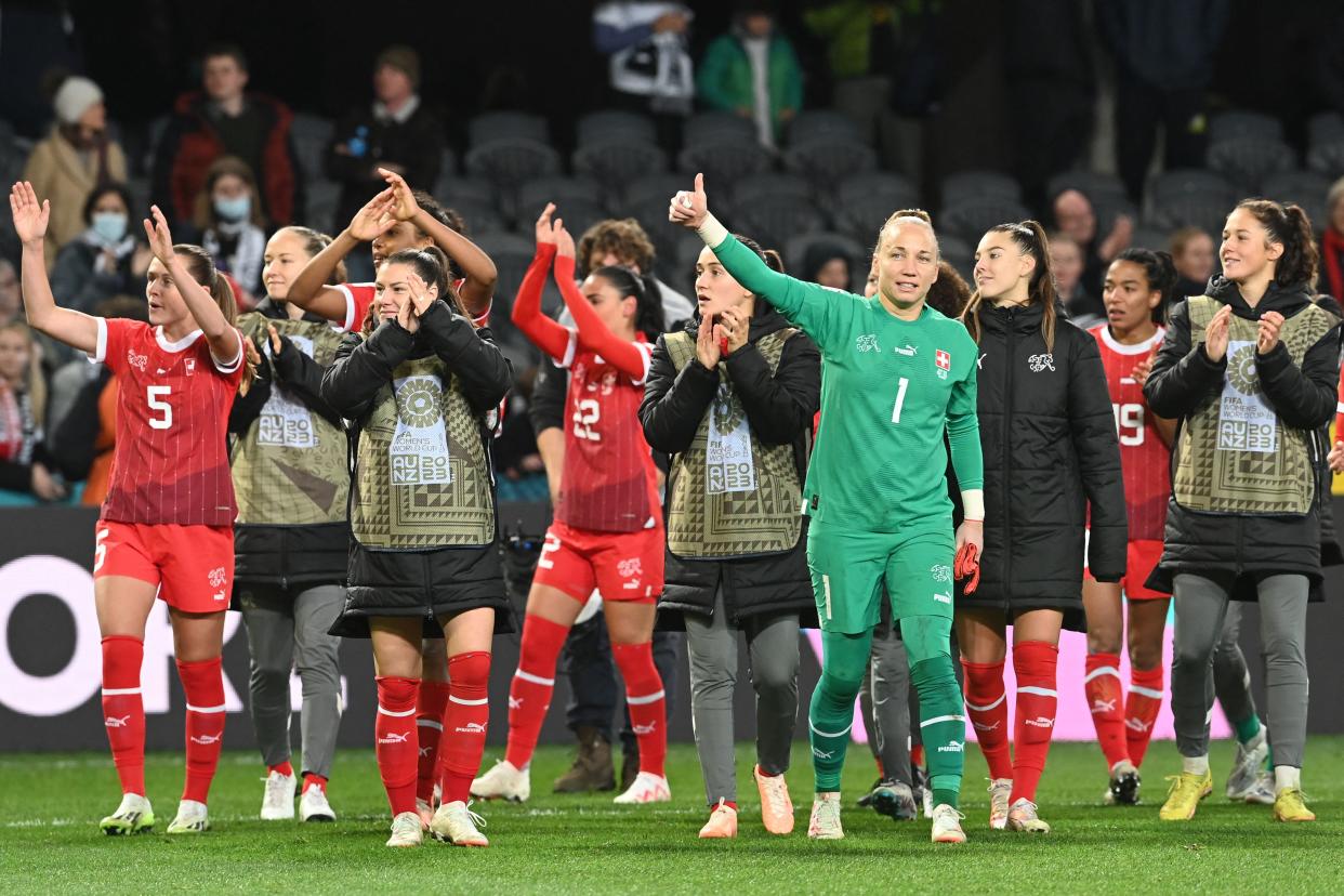 Switzerland's goalkeeper #01 Gaelle Thalmann (R) and teammates greet supporters at the end of the Australia and New Zealand 2023 Women's World Cup Group A football match between Switzerland and New Zealand at Dunedin Stadium in Dunedin on July 30, 2023. (Photo by Sanka Vidanagama / AFP) (Photo by SANKA VIDANAGAMA/AFP via Getty Images)