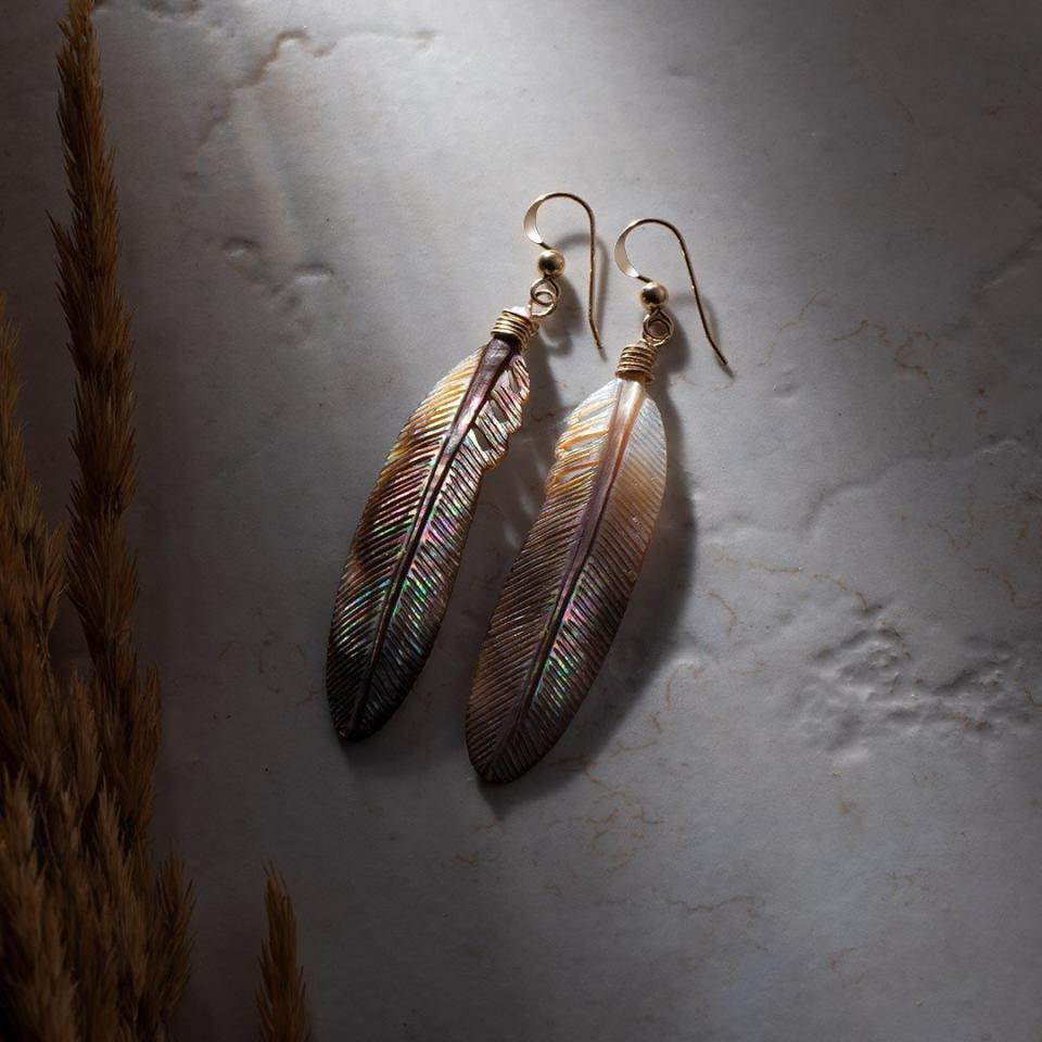 photo of feather earrings by native creator plain to sea 