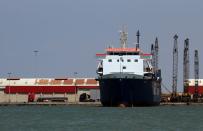 A cargo ship is seen at the port of Tripoli