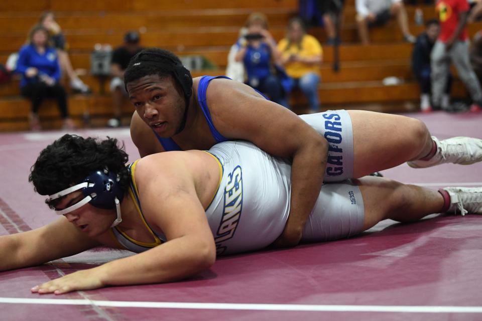 Auburndale's Nate Gabriel, top, strong-arms Land O' Lakes wrestler Garry Gilbert. Gabriel won his first regional championship in his high school tenure.