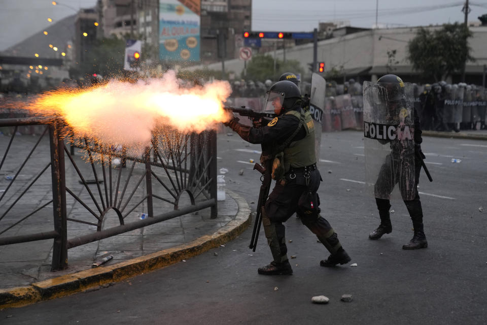 Police launch tear gas to disperse demonstrators seeking immediate elections, President Dina Boluarte's resignation, the release of ousted President Pedro Castillo and justice for protesters killed in clashes with police, in Lima, Peru, Saturday, Jan. 28, 2023. (AP Photo/Martin Mejia)