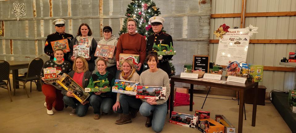 The Ag Toy Drive event committee pictured with the Wayne County Toys for Tots at the Nov. 30 event. Wayne County Toys for Tots is one of three organizations that receives the benefit of the Ag Toy Drive collections.