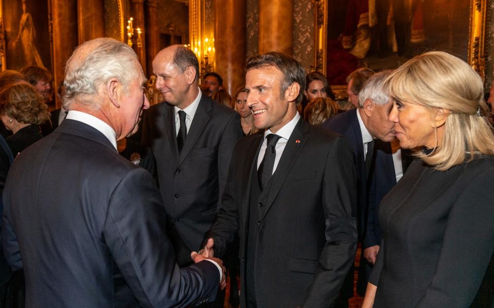 King Charles with Emmanuel Macron and his wife Brigitte Macron during a reception at Buckingham Palace for Heads of State and overseas visitors, September 18 2022 - Fergus Burnett Photography