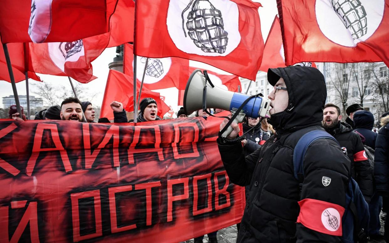 National Bolshevik protesters in Moscow hold a sign reading 