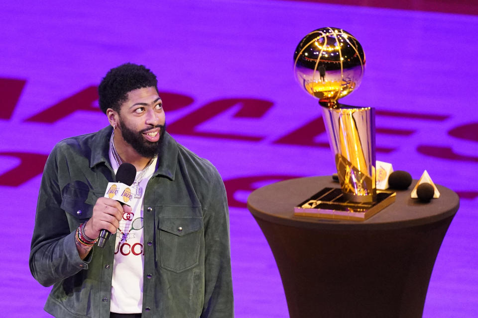 Los Angeles Lakers forward Anthony Davis speaks to the crowd after the Lakers unveiled their 2019-2020 World Championship banner prior to an NBA basketball game against the Houston Rockets Wednesday, May 12, 2021, in Los Angeles. (AP Photo/Mark J. Terrill)