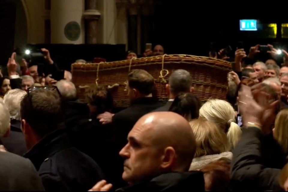 Shane MacGowan’s wicker casket leaves the church (Pogues livestream)