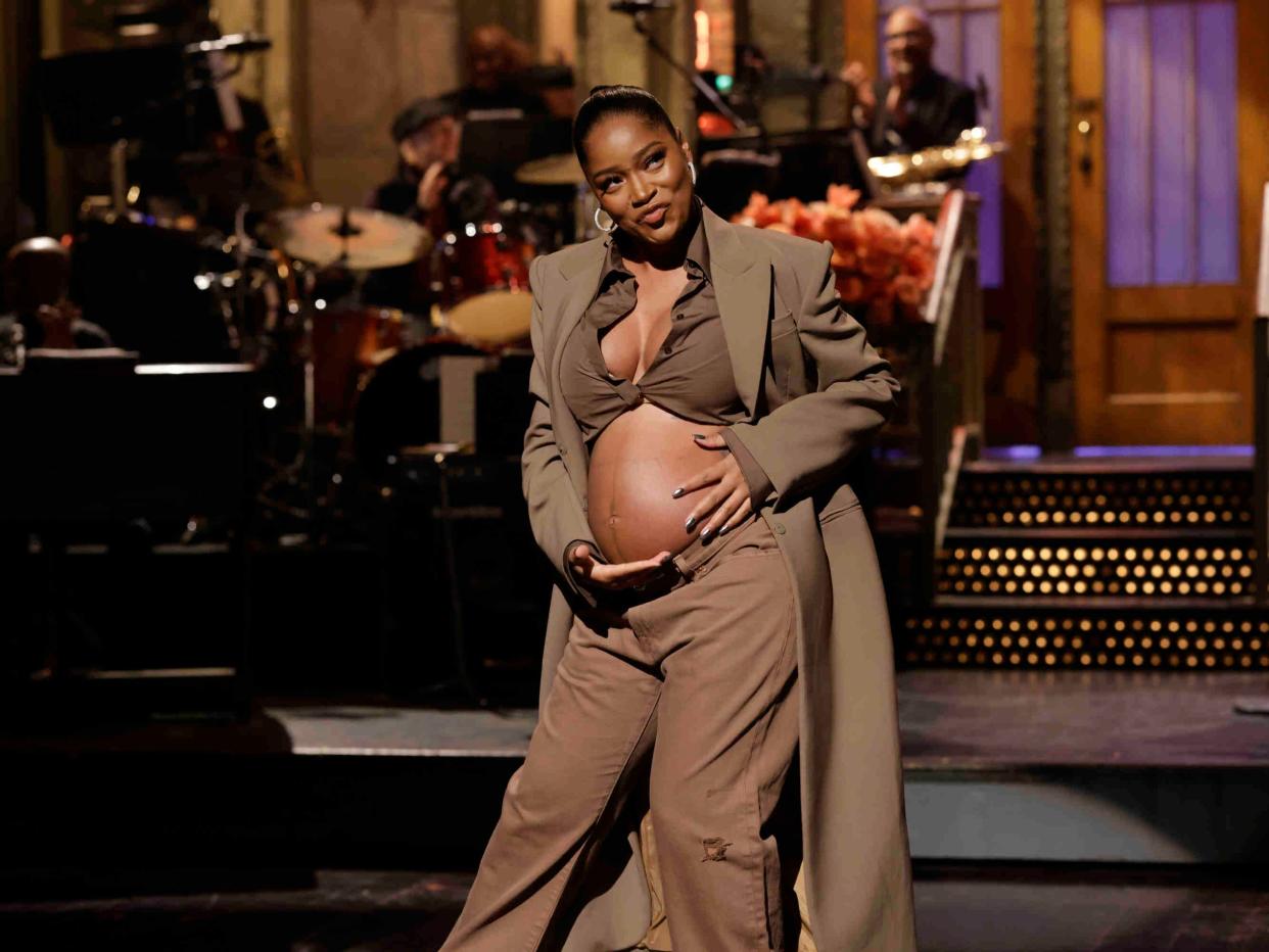 Keke Palmer shows baby bump during a monologue on "Saturday Night Live" on December 3, 2022.