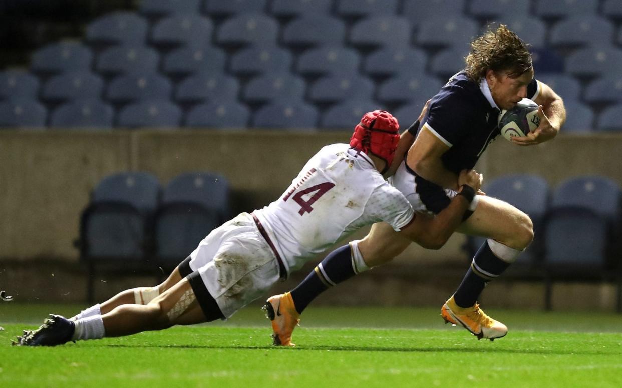 Hamish Watson scores his side's third try of the game  - PA