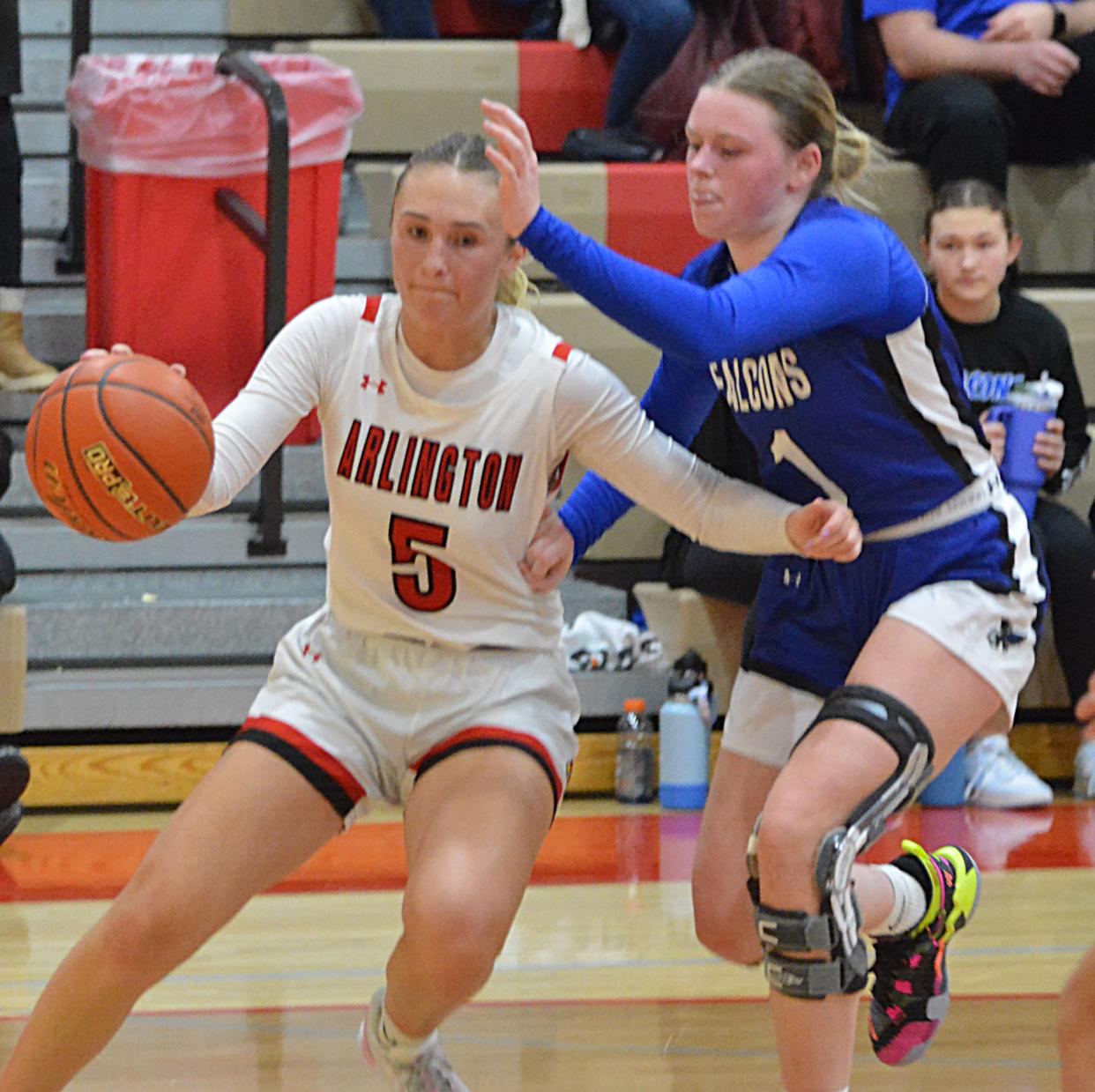 Arlington's Jaelyn Huntimer drives the baseline against Florence-Henry's Haley Hlavacek during their high school girls basketball game on Tuesday, Jan. 23, 2024 in Arlington. Arlington won 51-44.