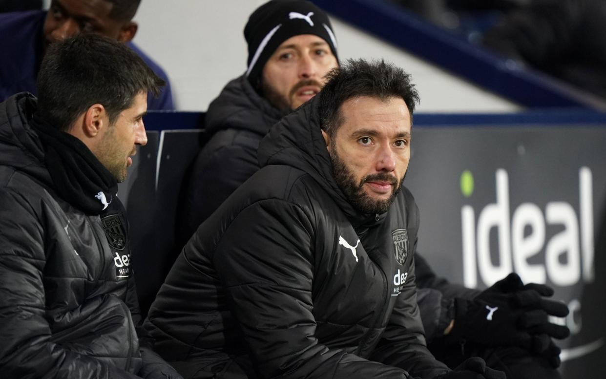 Carlos Corberan sits on the bench at The Hawthorns - PA/Tim Goode