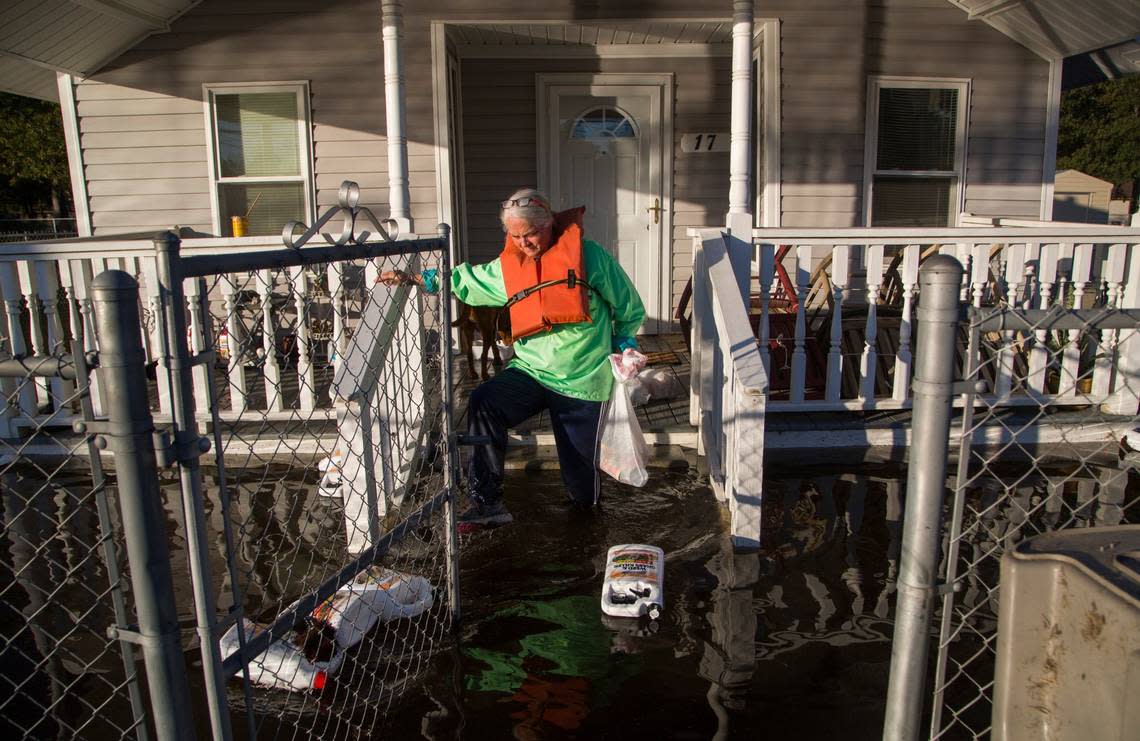 Delores Miller checks on her elderly mother’s home in downtown Lumberton after Hurricane Matthew caused downed trees, power outages and massive flooding along the Lumber River Tuesday, October 11, 2016 in Lumberton, NC.