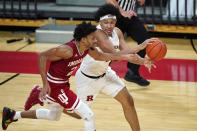 Rutgers guard Ron Harper Jr., right, looks to pass the ball as Indiana guard Armaan Franklin (2) defends during the second half of an NCAA college basketball game Wednesday, Feb. 24, 2021, in Piscataway, N.J. (AP Photo/Kathy Willens)