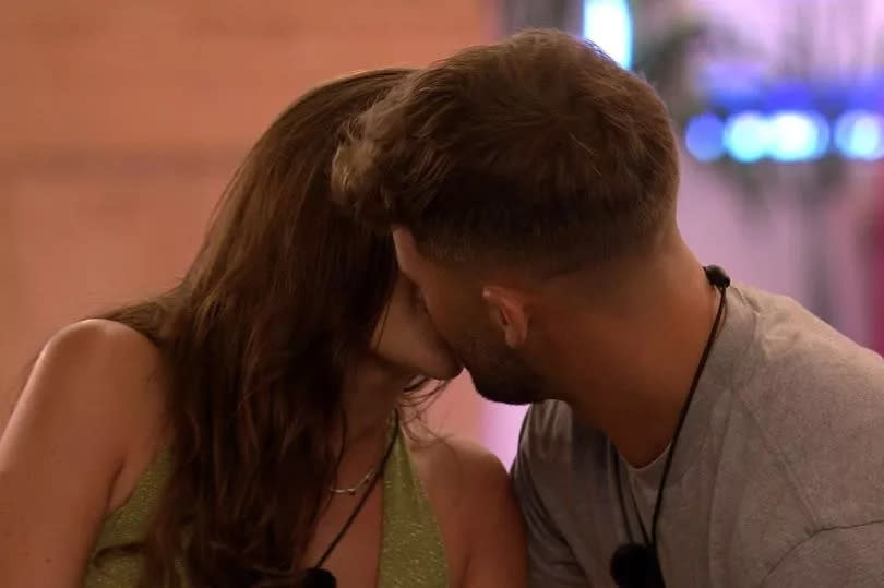 Ciaran Davies and Emma Milton sharing a kiss on Love Island.