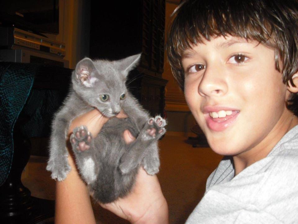 Shuggie Pop as a kitten meets nephew Hub Chason III in 2011.