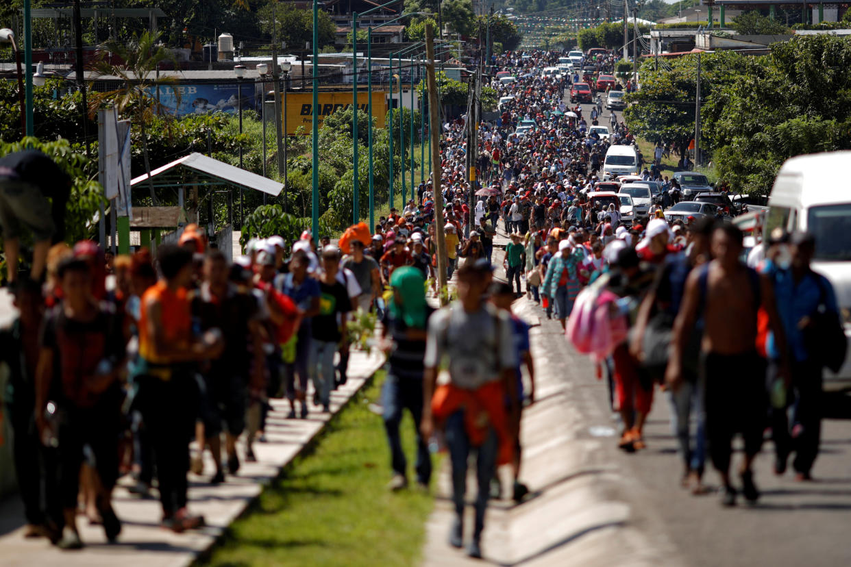 Central American migrants walk along the highway near the border with Guatemala in Tapachula, Mexico, on Sunday as they continue their attempt to reach the U.S. (Photo: Ueslei Marcelino/Reuters)