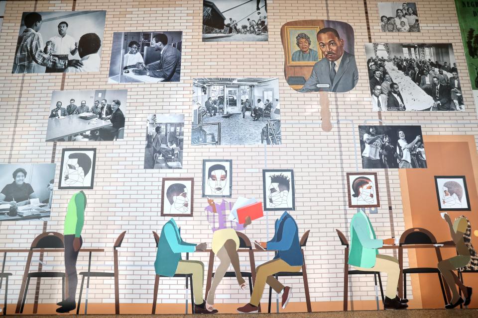 Historic photographs are combined with artistic collages of everyday Black life and leisure as part of the "Our Time Together" mural at the Milwaukee Art Museum.