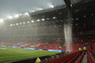 FILE - The rain comes down from the roof at the Old Trafford stadium at the end of the English Premier League soccer match between Manchester United and Arsenal, in Manchester, England, Sunday, May 12, 2024. An Associated Press analysis found the number of publicly-traded “zombie” companies — those so laden with debt they're struggling to pay even the interest on their loans — has soared to nearly 7,000 around the world, including 2,000 in the United States. (AP Photo/Dave Thompson, File)