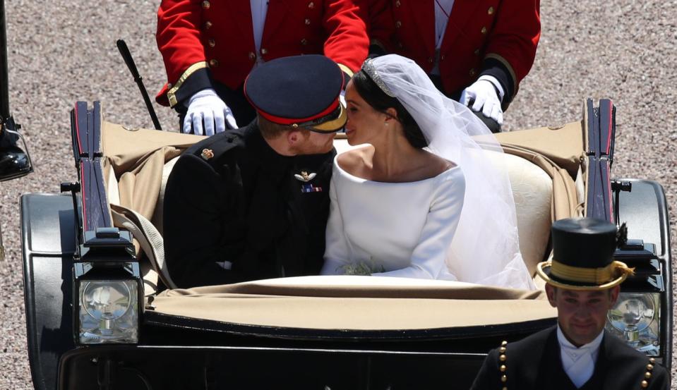 The couple snuck a second kiss during the carriage ride.