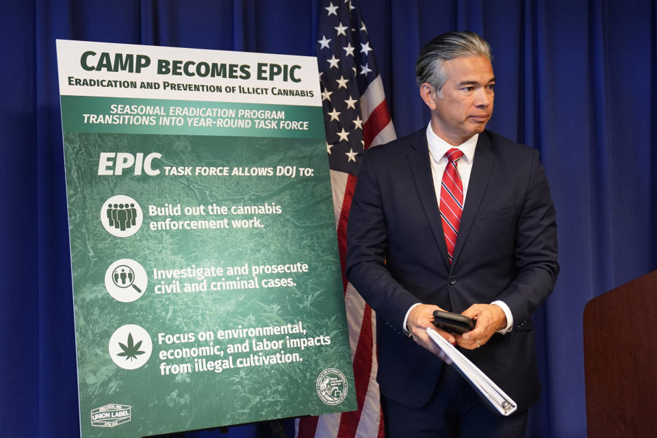 California Attorney General Rob Bonta leaves the podium after a Sacramento news conference where he announced the state will expand it's 13-week program to eradicate illegally cultivated cannabis to a year-round program, Tuesday, Oct. 11, 2022. The Eradication and Prevention of Illicit Cannabis, (EPIC) program will focus on addressing environmental, economic and labor crimes associated with the illegal cultivation of marijuana. (AP Photo/Rich Pedroncelli)