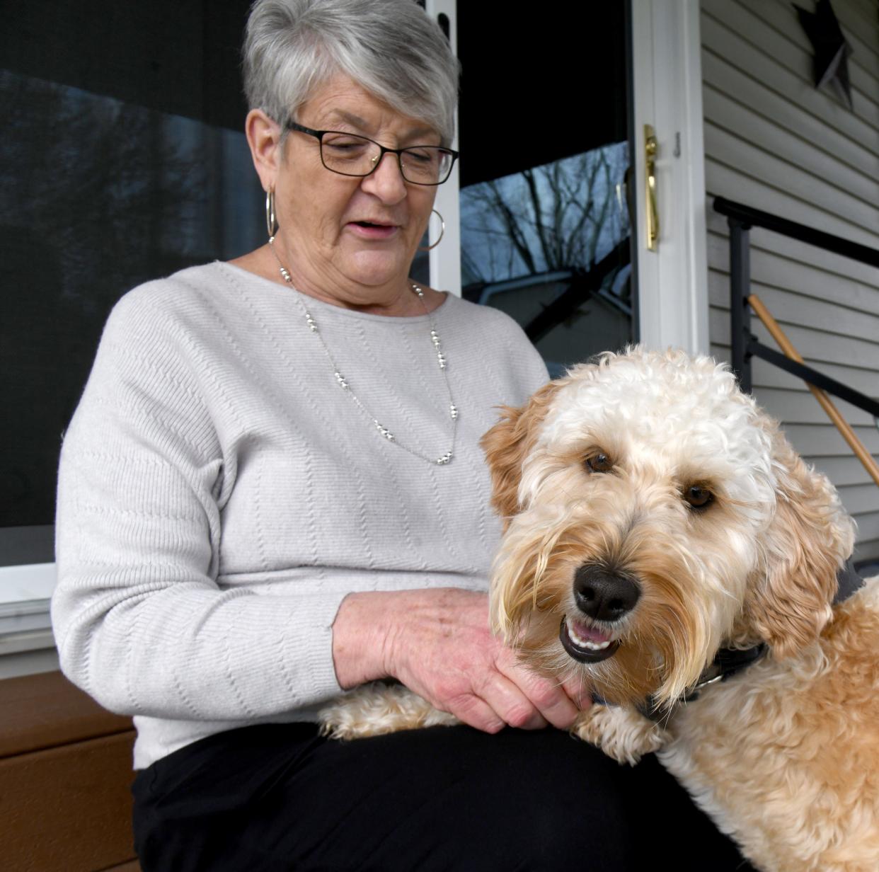 Barbara Jasinski of Massillon said she lost $1,400 trying to buy a puppy from a breeder in Mahoning County. "I love dachshunds. I thought two would be cool." She later bought this goldendoodle, Sadie.