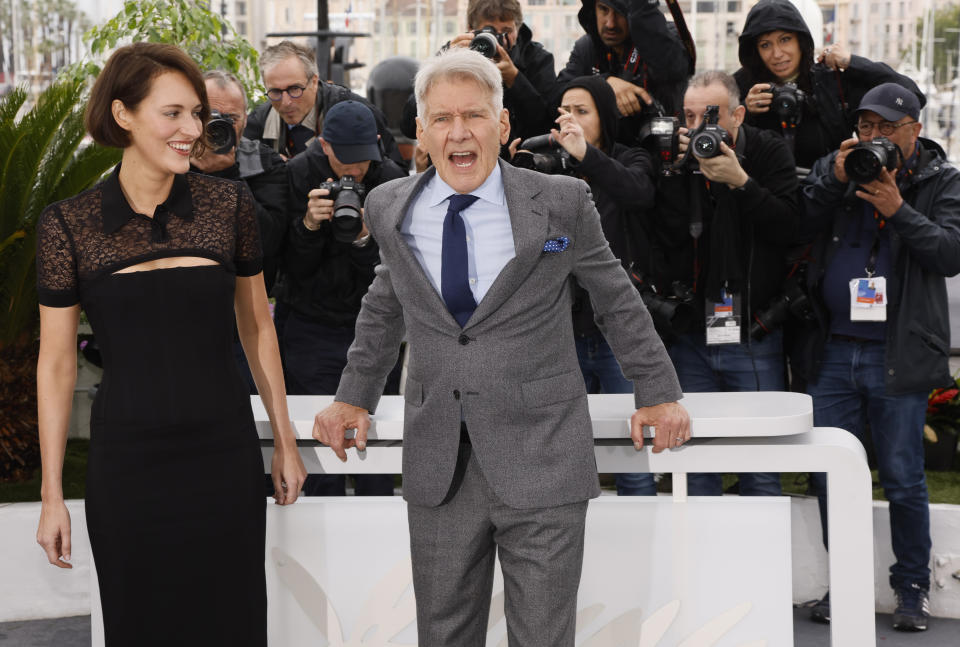 Phoebe Waller-Bridge, left, and Harrison Ford pose for photographers at the photo call for the film 'Indiana Jones and the Dial of Destiny' at the 76th international film festival, Cannes, southern France, Friday, May 19, 2023. (Photo by Joel C Ryan/Invision/AP)