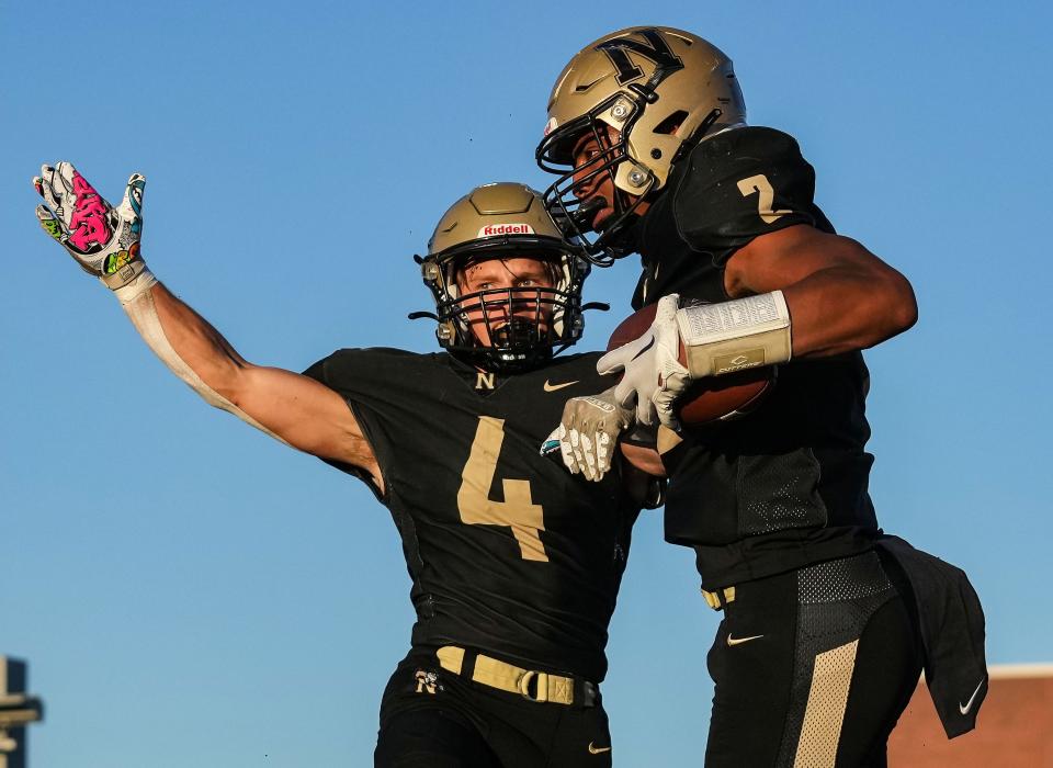 Noblesville Millers Logan Shoffner (4) and Noblesville Millers tight end Aiden Brewer (2) celebrates a touchdown Friday, Sept. 1, 2023, during the game against the Fishers Tigers at Noblesville High School in Noblesville. The Fishers Tigers defeated the Noblesville Millers, 48-22.