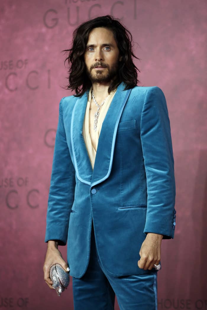 Jared in a velvet Gucci suit and holding a sparkly clutch at the film's premiere