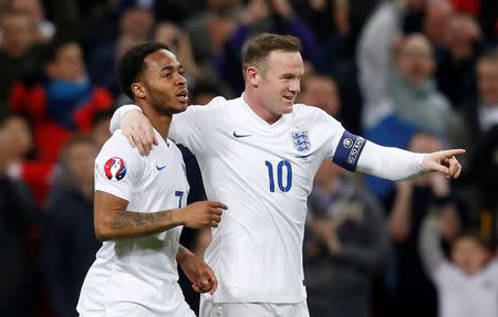 Football - England v Lithuania - UEFA Euro 2016 Qualifying Group E - Wembley Stadium, London, England - 27/3/15 England's Raheem Sterling celebrates scoring their third goal with Wayne Rooney Action Images via Reuters / Carl Recine