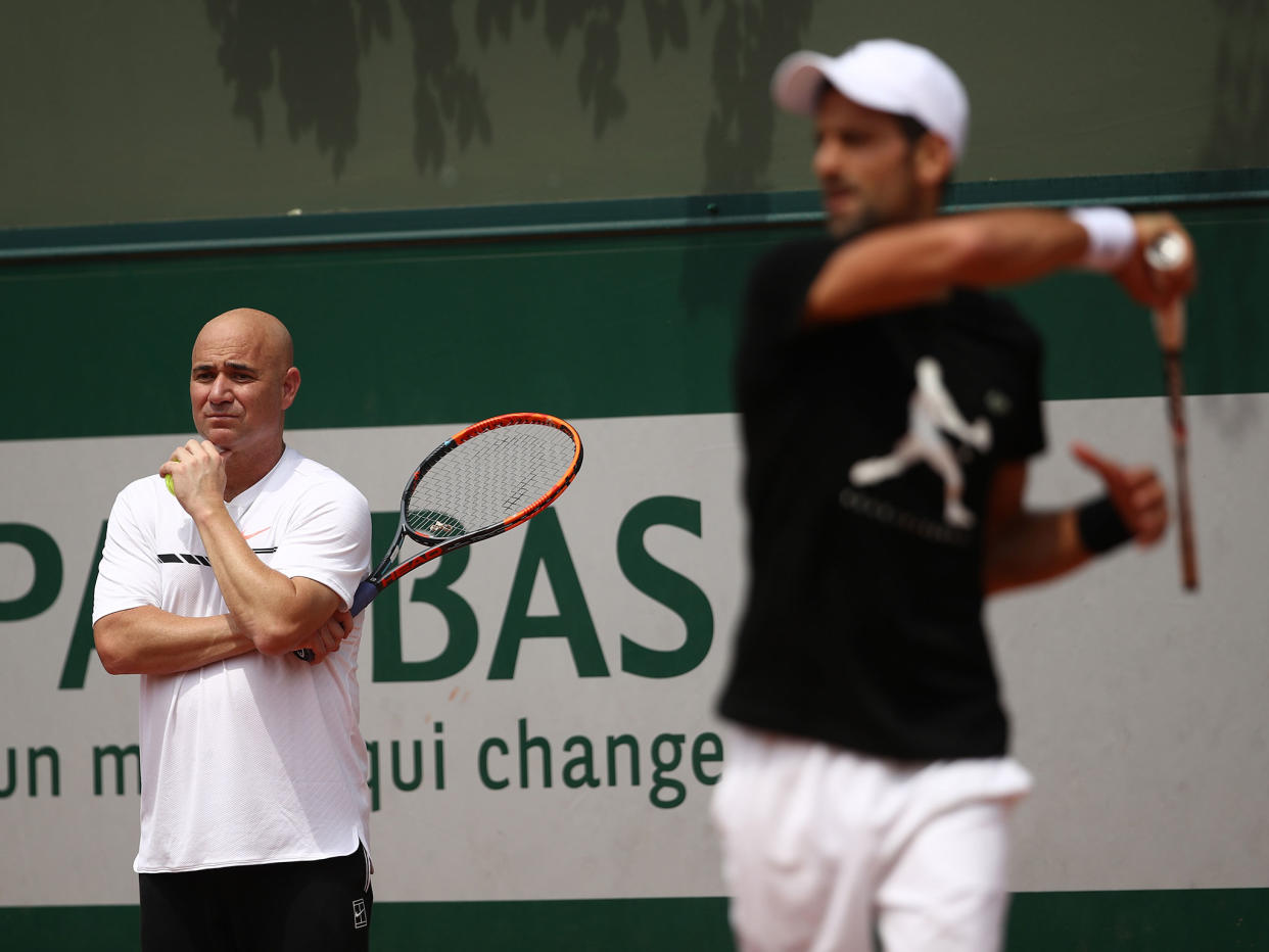 Andre Agassi watches on as Novak Djokovic trains in Paris: Getty