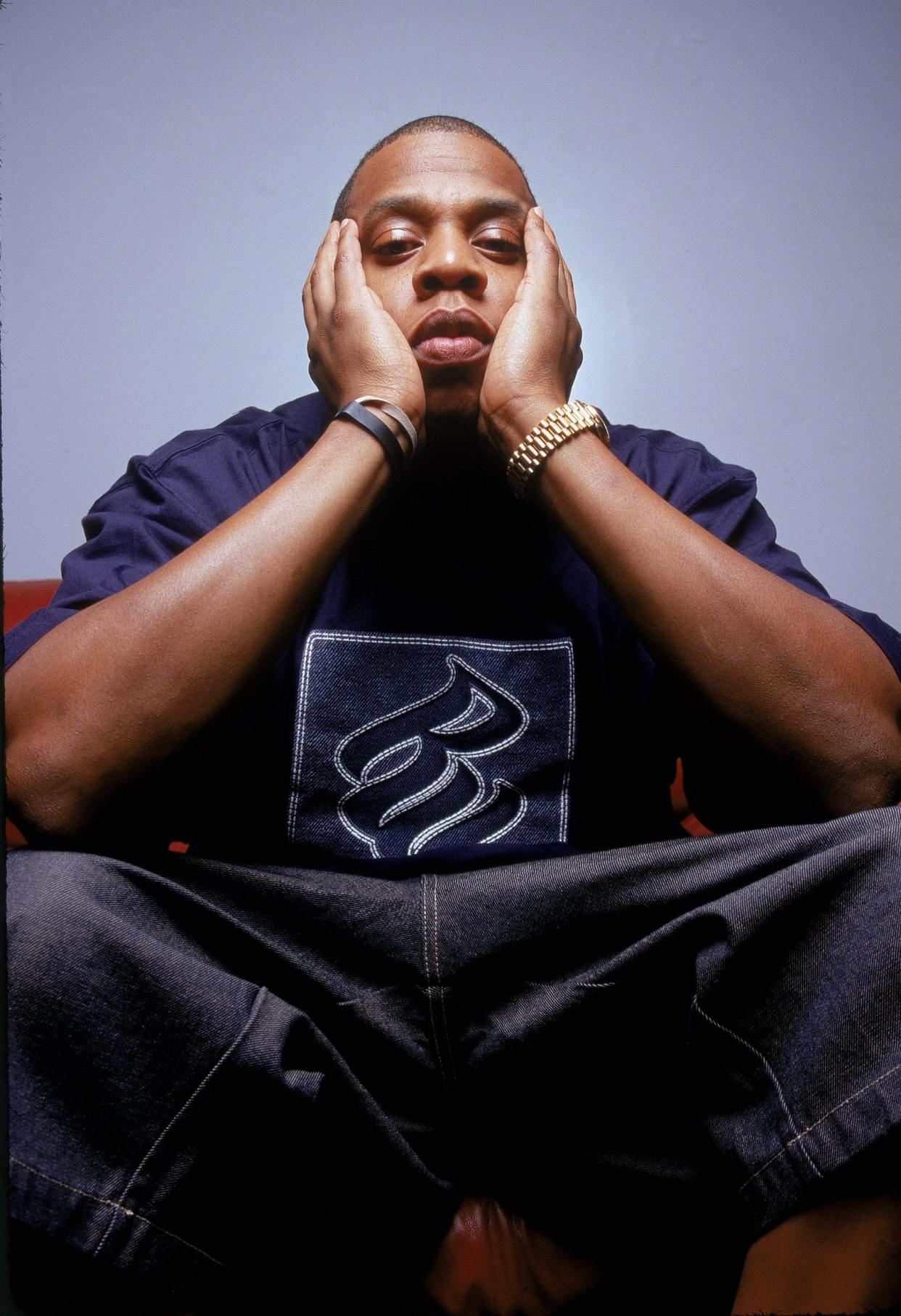 Jay Z poses in Rocawear shirt.