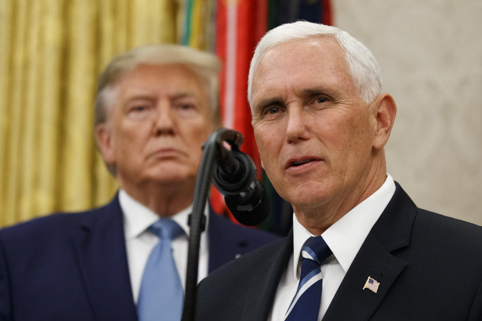 Vice President Mike Pence, right, speaks with President Donald Trump behind him, during a ceremony to present the Presidential Medal of Freedom to former Attorney General Edwin Meese on Oct. 8. (Photo: Alex Brandon/ASSOCIATED PRESS)