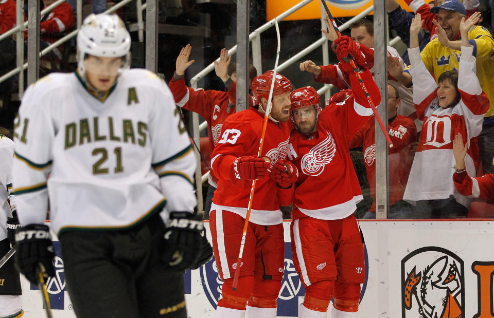 DETROIT, MI - FEBRUARY 14: Henrik Zetterberg #40 of the Detroit Red Wings celebrates his first period goal with Johan Franzen #93 next to Loui Eriksson #21 of the Dallas Stars at Joe Louis Arena on February 14, 2012 in Detroit, Michigan. (Photo by Gregory Shamus/Getty Images)