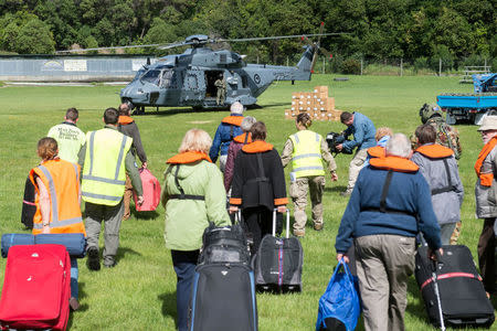 A Royal New Zealand Air Force NH90 helicopter prepares to evacuate those stranded in Kaikoura on the South Island of New Zealand November 16, 2016, following the recent earthquakes. CPL Amanda McErlich/Courtesy of Royal New Zealand Defence Force/Handout via REUTERS