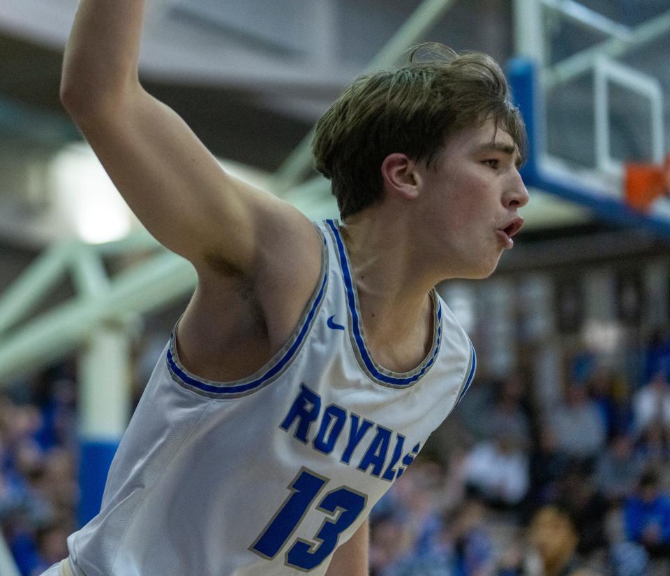 Hamilton Southeastern High School's Braeden Totton (13) styles a three point bucket against Fishers at Carmel High School, Tuesday, Feb. 28, 2023, during the Fishers boys’ sectional win over HSE, 68-49. 