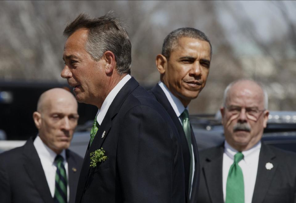 President Barack Obama and House Speaker John Boehner of Ohio part ways following a St. Patrick's Day luncheon on Capitol Hill in Washington, Friday, March 14, 2014. The political rivals came together to host a gathering for Taoiseach Enda Kenny of Ireland. They are flanked by House Sergeant at Arms Paul Irving, left, and Senate Sergeant at Arms Terrance Gainer. (AP Photo/J. Scott Applewhite)