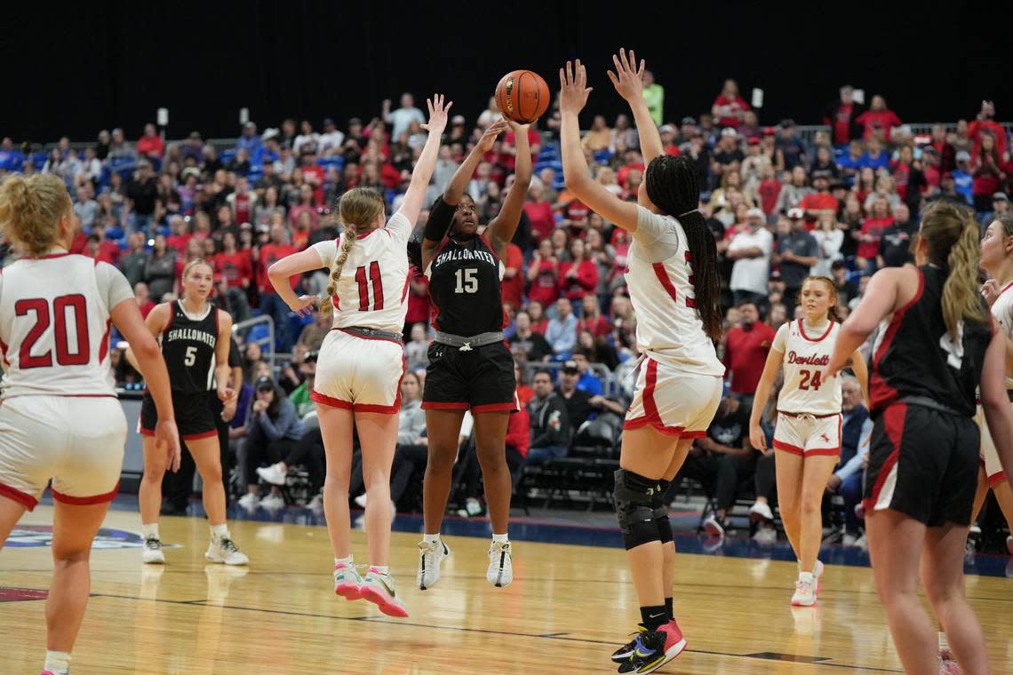 Shallowater’s Keelie Williams (15), the Championship Game MVP, gets off a shot over Huntington’s Lexi Litton (11) and Kyra Anderson (33) in the Class 3A state championship game on Saturday, March 2, 2024 at the Alamodome in San Antonio, Texas. Shallowater defeated Huntington 54-49 in OT.