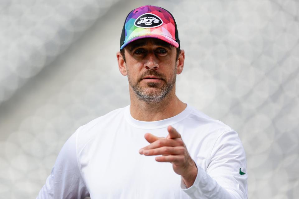 New York Jets quarterback Aaron Rodgers walks on the field before an NFL football game against the Philadelphia Eagles, Sunday, Oct. 15, 2023, in East Rutherford, N.J.