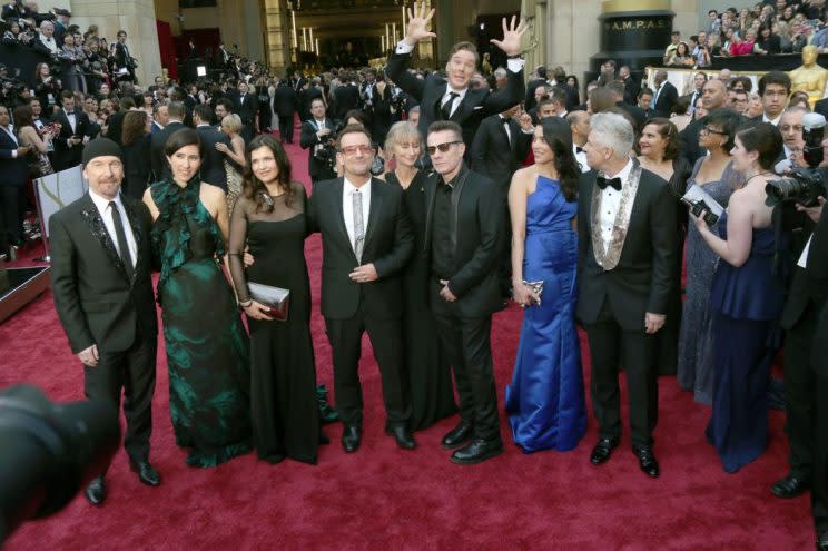 U2’s The Edge (l-r), Morleigh Steinberg, Ali Hewson, Bono, Larry Mullen Jr., Mariana Teixeira, and Adam Clayton and actor Benedict Cumberbatch at the 86th Academy Awards in 2014. (Photo: Hubert Boesl DPA /LANDOV)