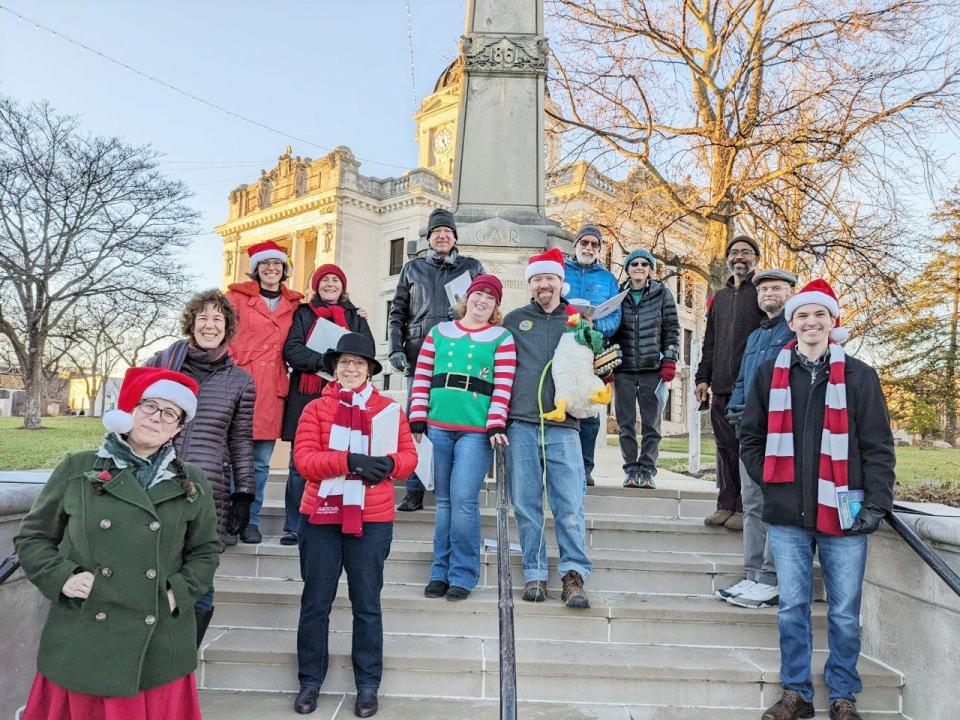 Global Warblers pose for a photo while on the Monroe County Courthouse Square after caroling over the winter holidays.